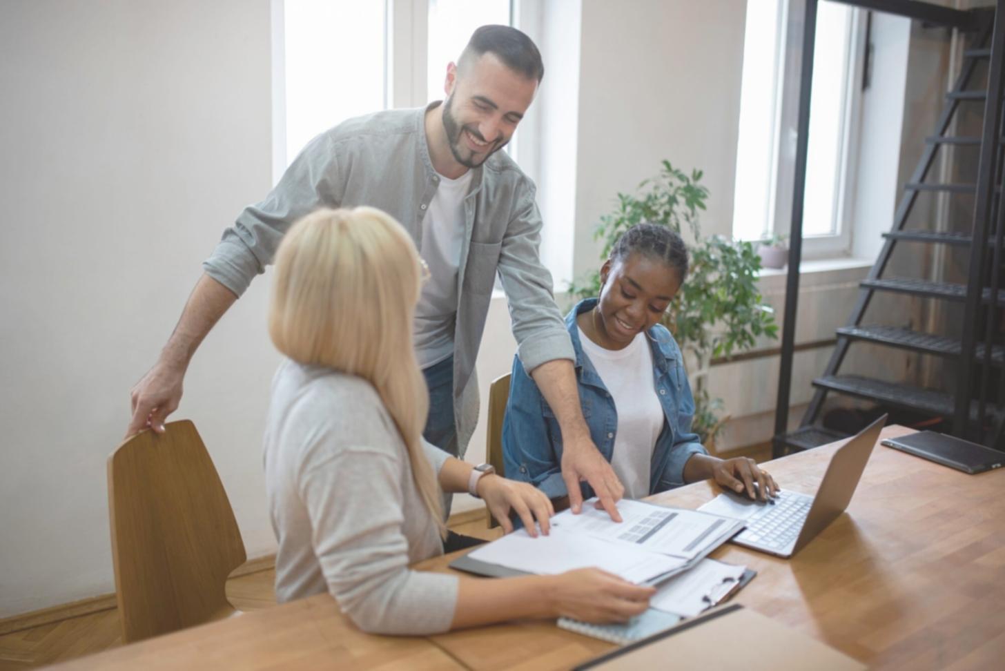 Australian family reviewing household budget together at kitchen table