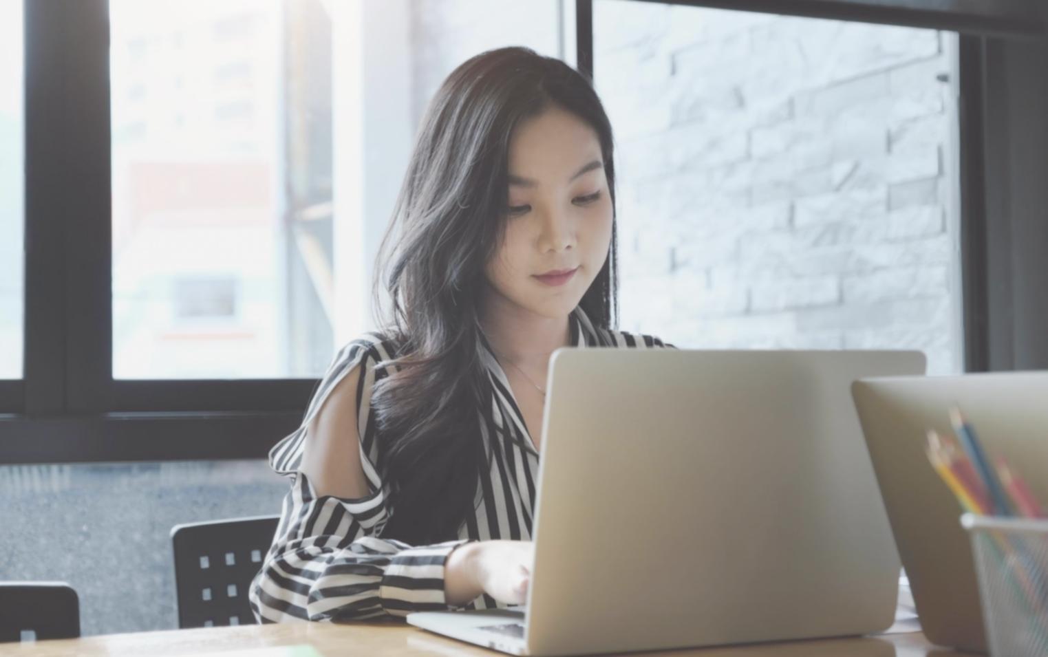 Participants reviewing household budget planning materials in collaborative learning environment